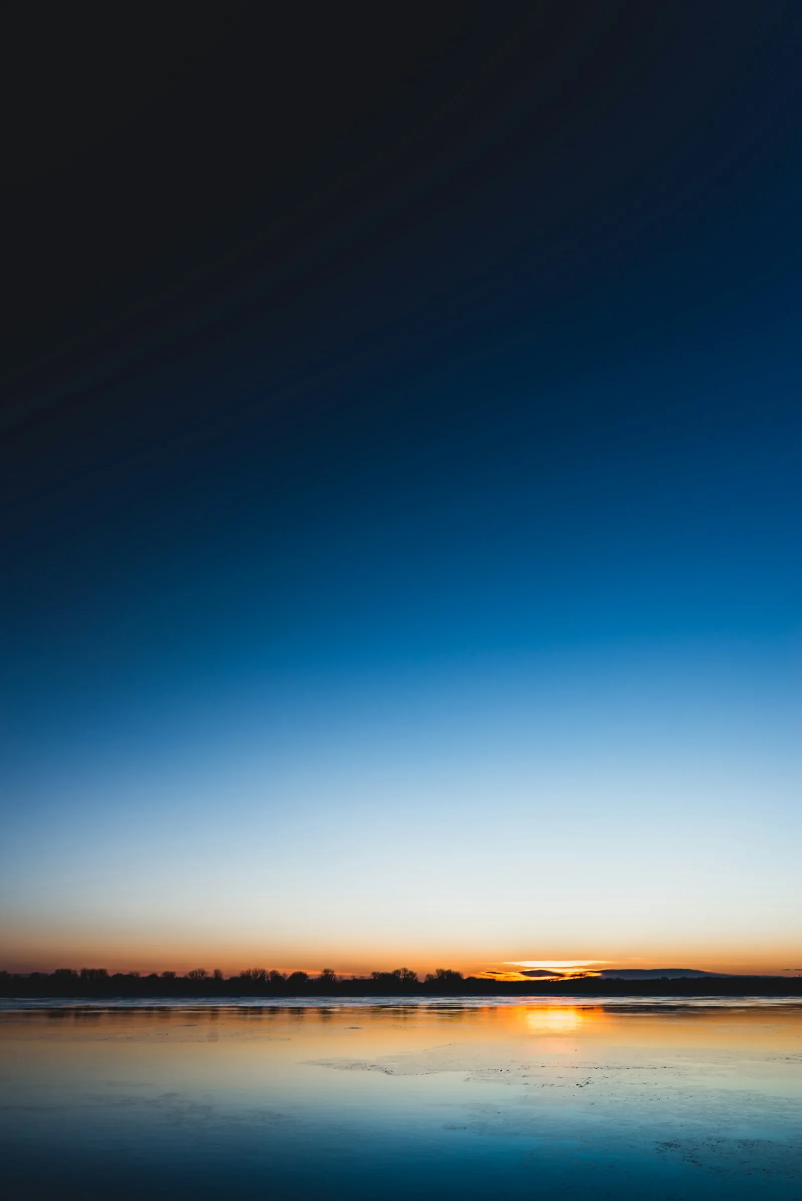 Warm firelight in a darkened, quiet space Warm firelight in a darkened, quiet space