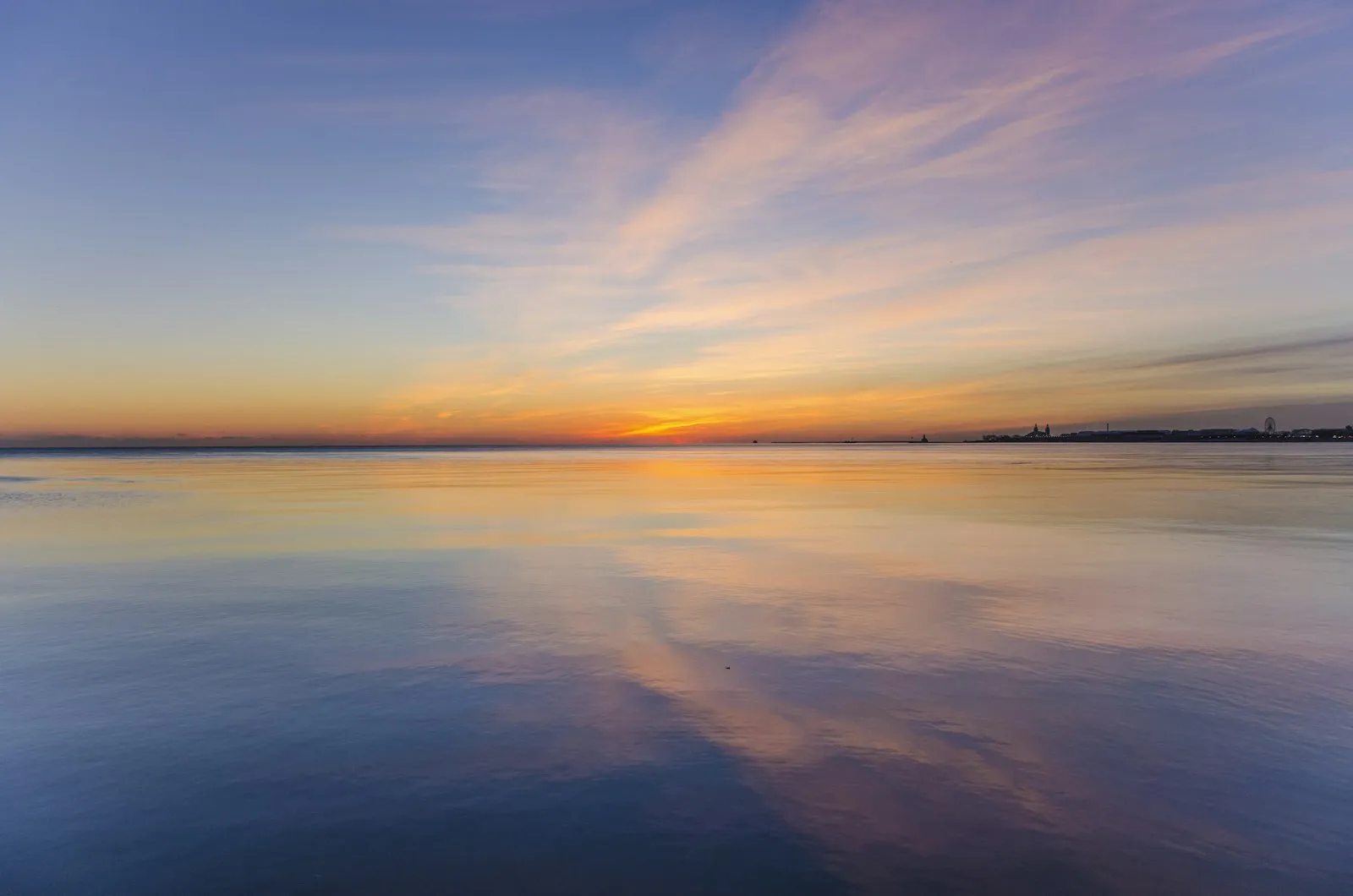 Calm water under a soft sky
