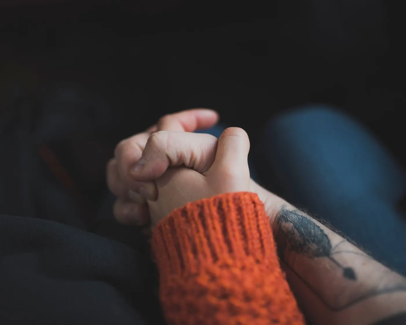 Two pairs of hands held in warm light, couples therapy at The Trinity in Fort Worth Two pairs of hands held in warm light, couples therapy at The Trinity in Fort Worth